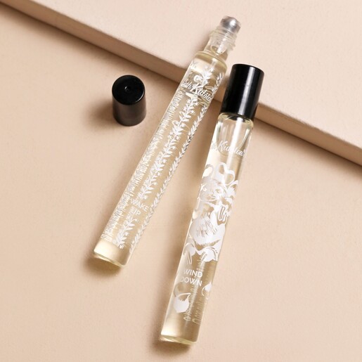 Cath Kidston Wake Up and Wind Down Roller Ball Duo Glass Vials Uncapped on Pink Surface