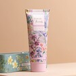 Close Up of the Front of Flower of Focus Power Through Shea Butter Hand Cream Tube