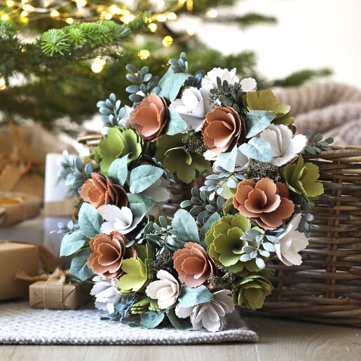 Wooden Pink and Green Blooms Wreath in lifestyle shot in front of Christmas tree