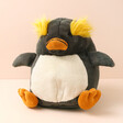 Jellycat Maurice Macaroni Penguin Soft Toy against a neutral coloured background