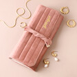 Personalised Dusky Pink Velvet Jewellery Roll with jewellery outside on neutral background