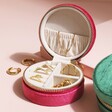 Personalised Quilted Velvet Mini Round Travel Jewellery Case in Pink Open on Beige Surface