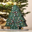 Fill Your Own Christmas Tree Advent Calendar ion counter in front of Christmas tree