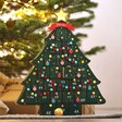 Personalised Fill Your Own Christmas Tree Advent Calendar on countertop with Christmas tree in background