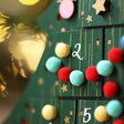Close up of pompom christmas lights across Personalised Fill Your Own Christmas Tree Advent Calendar