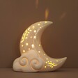 Ceramic LED Celestial Moon Light in front of neutral backdrop 