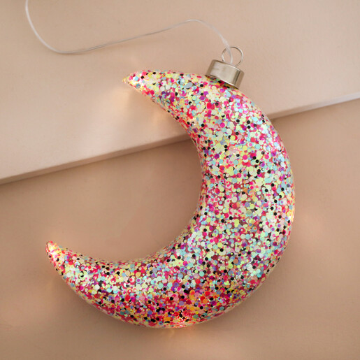 Hanging Pink Glitter LED Moon Light on Beige Background