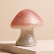 Small Pink Glass Mushroom Light on pink background 