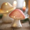 Small Pink Glass Mushroom Light in lifestyle shot on wooden surface