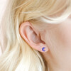 Close up of Sterling Silver Blue Glitter Moon Stud Earrings on blonde model