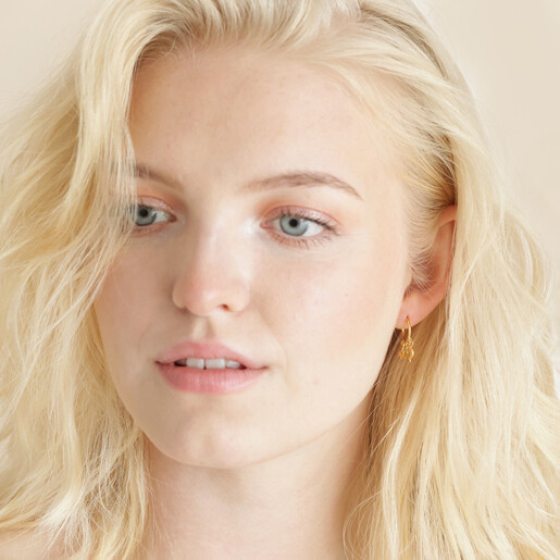 Celestial Charm Huggie Hoop Earrings in Gold on Model