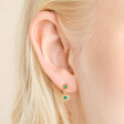 Close up of Gold Sterling Silver Green Crystal and Malachite Sun Drop Earrings on model