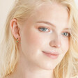 Model smiling wearing Gold Sterling Silver Green Crystal and Malachite Sun Drop Earrings