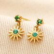 Gold Sterling Silver Green Crystal and Malachite Sun Drop Earrings against neutral coloured fabric