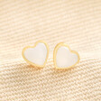 Gold Sterling Silver Mother of Pearl Heart Stud Earrings on Beige Fabric