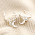 Sterling Silver Moon and Star Charm Hoops on top of beige coloured fabric