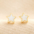 Mother of Pearl Star Stud Earrings in Gold on top of beige coloured fabric