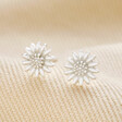 Sterling Silver Flower Stud Earrings on top of neutral coloured fabric