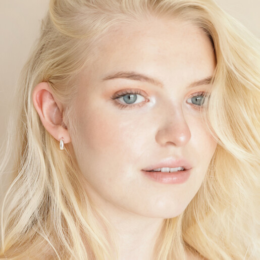 Sterling Silver Small Domed Hoop Earrings on model