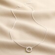 Sterling Silver Crystal Hoop Pendant Necklace full length against neutral material