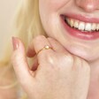 Model smiling wearing Gold Sterling Silver Crystal and Opal Cluster Ring