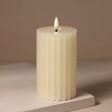 Cream Ribbed Wax LED Pillar Candle on Beige Background 