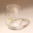 Gold Star Glass Tumbler against neutral coloured background