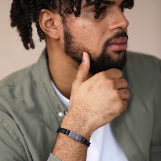 Bracelet on Model Model wearing Personalised Men's Double Leather Bracelet in black with hand on chin
