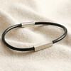 Men's Leather Cord and Bar Bracelet in Black on neutral coloured fabric