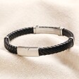 Back of Men's Stainless Steel Feature Braided Leather Bracelet in Black showing clasp on top of beige coloured material