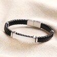 Men's Stainless Steel Feature Braided Leather Bracelet in Black on top of beige coloured fabric