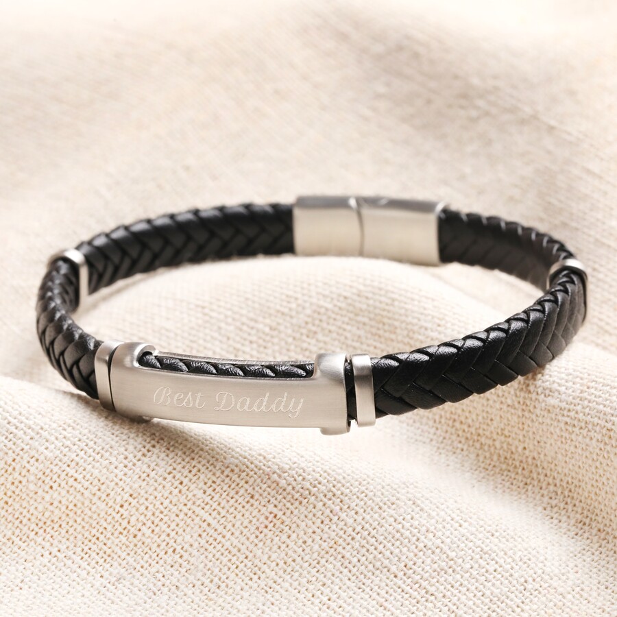 Personalised Men’s Stainless Steel Feature Braided Leather Bracelet in Black against neutral coloured fabric
