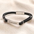 Personalised Men's Double Braided Leather Bracelet with date personalisation on top of neutral coloured backdrop