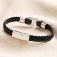 Clasp on Stainless Steel Hook Feature Braided Leather Bracelet in Black on top of beige coloured backdrop