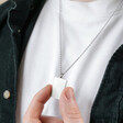 Men's Stainless Steel Tag Pendant Necklace on Model and Pinched Between Fingers