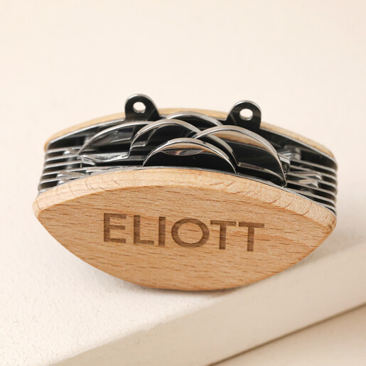 Close up of Personalised Crab Multi Tool against neutral background tools enclosed