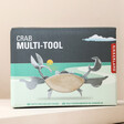 Front of Personalised Crab Multi Tool packaging against natural backdrop