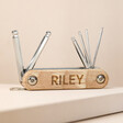 Personalised Hex Bike Tool Set with tools out of cover against neutral coloured background