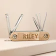 Personalised Hex Bike Tool Set with tools out of cover against neutral coloured background