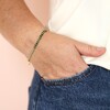 Adjustable Green Ombre Stone Bracelet in Gold on model's wrist in pocket