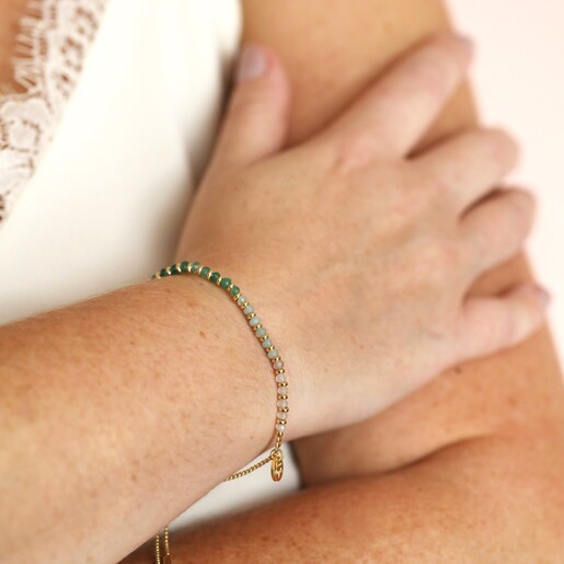 Adjustable Green Ombre Stone Bracelet in Gold on model's wrist