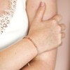 Model Wearing Adjustable Pink Ombre Stone Bracelet in Gold