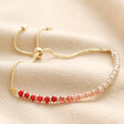 Adjustable Pink Ombre Stone Bracelet in Gold on Beige Fabric