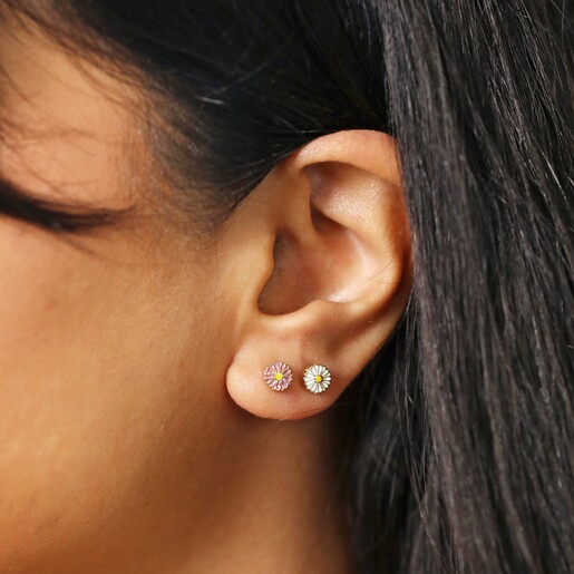 Close Up of Model Wearing Set of Four Enamel Daisy Stud Earrings in Gold
