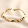 Green Baguette Crystal Chain Bracelet in Gold on Beige Fabric