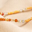 Close up of beads on Sacral Chakra Beaded Necklace in Gold