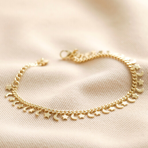 Tiny Moon and Star Charm Bracelet in Gold on Beige Fabric