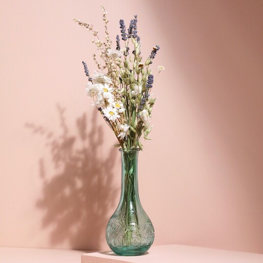 Blue Glass Posy Vase with posy inside against pink coloured backdrop