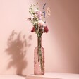 Pink Glass Bottle Vase with posy inside