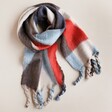 Abstract Patterned Winter Scarf arranged on neutral coloured background